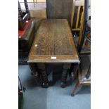 An oak barleytwist drop leaf table