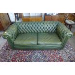 A Chesterfield green leather settee