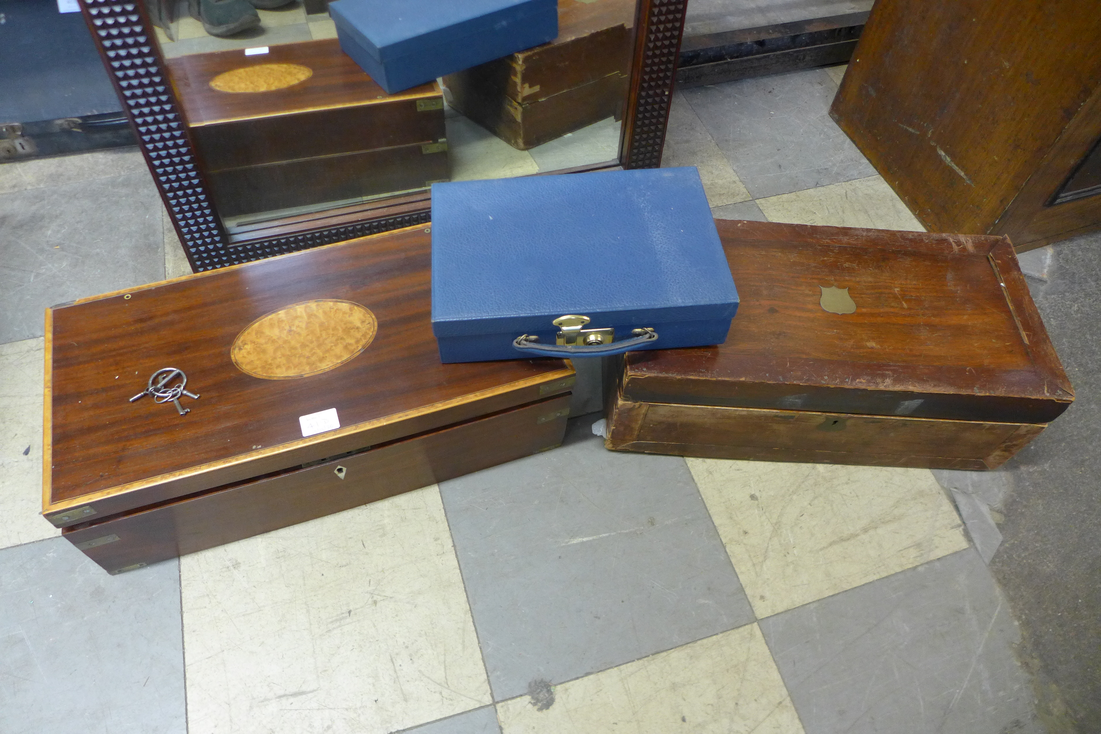 A Victorian mahogany, brass and maple inlaid writing slope, a mahogany writing slope and a