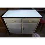 A 1960's painted metamorphic kitchen cabinet