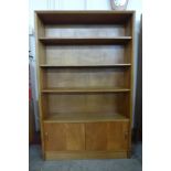 A Herbert Gibbs teak open bookcase