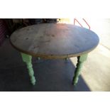 A pine scrub top circular kitchen table