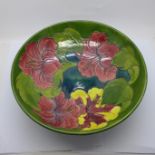 A mid 20th Century Moorcroft Hibiscus on green ground fruit bowl, 26.5cm diameter