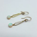 A cased pair of yellow metal, diamond and opal drop earrings, tests as high carat