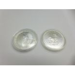 An Australian Kangaroo 2018 1oz 999 silver $1 coin and a 2020 1oz fine silver Krugerrand coin