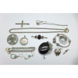 A silver bracelet, cross pendant, earrings, locket, etc.