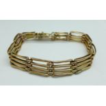 A yellow metal bracelet, 12.4g, (stamped 10 in the clasp)