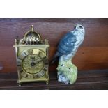A brass lantern clock with battery movement and a Beswick Merlin Beneagles decanter, (lacking