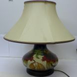 A large Moorcroft tube line squat shaped lamp base in the Anna Lily design, designer Nicola Stanley,