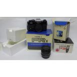 A Yashica FRI SLR camera body, a Yashica 50mm f1.7 standard lens and a Sunpak Gx28 electronic