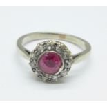 A white metal ring, ruby and diamond cluster ring, marked 18ct, 2.8g, N