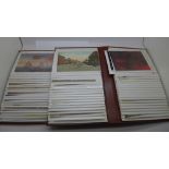 Two albums of approximately 160 Edwardian and later postcards