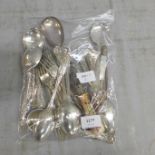 A collection of cutlery including a silver fork (67g) and other plated items