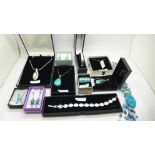 A collection of silver jewellery including turquoise and mother of pearl