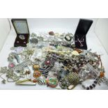 A collection of costume jewellery including brooches and beaded necklaces, and a Bouchet Agateware