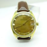 An 18ct gold Universal Polerouter date automatic wristwatch with engraved back