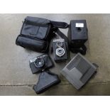 Four cameras and a camera case