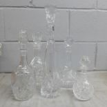 A box of cut glass decanters