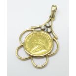 A 9ct gold and three stone diamond set coin mount with a 1986 1/10th Krugerrand, total weight 5.9g