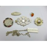 A collection of silver jewellery;- an ingot pendant on chain, two Victorian brooches including '