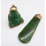 A 14ct gold mounted jade Buddha pendant and a hallmarked 9ct gold mounted pendant, Chester 1920