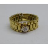 An 18ct gold and diamond 'bracelet' ring, 7g, L