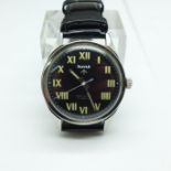 An HMT military wristwatch, with broad arrow on the dial and case back