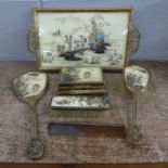 A gilt metal filigree dressing table set