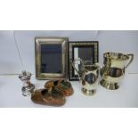 A silver photograph frame, plated jug, mug, a pair of copper shoes and a Rennie Mackintosh