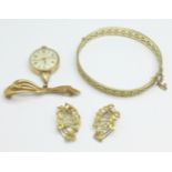 A pair of rolled gold earrings, a rolled gold bangle and a brooch/pendant watch marked Good Hope