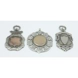 Three silver fobs, 29g