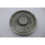 An ashtray marked 'Made from a Rolls Royce Merlin engine piston as used in the Battle of Britain