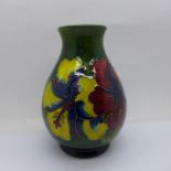 A Moorcroft Hibiscus on green ground vase, 14cm