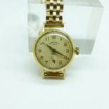 A lady's 9ct gold Camerer Cuss & Co., London, wristwatch, with 9ct gold strap, weight without