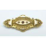 A 9ct gold, ruby and diamond brooch in case