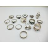 A collection of silver rings including two unmarked and thirteen stamped 925