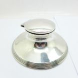 A silver hallmarked capstan inkwell with hinged lid and liner, Henry Matthews, Birmingham 1917