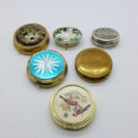 A collection of six pill boxes, including one silver and one abalone set