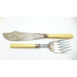 A pair of late Victorian fish servers with silver ferrules dated Sheffield 1900