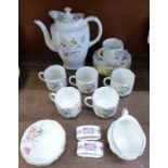 A Royal Crown Derby Derby Posies six setting coffee set and two napkin rings