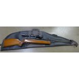 A Sterling Armaments 1980's .22 air rifle model no. HR81 and an extra sight, cased