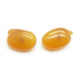 A pair of butterscotch amber cufflinks