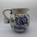 Honiton Pottery; a 1930's Jacobean pattern jug, 15cm