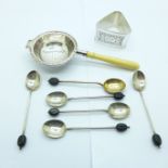 A silver tea strainer, six silver coffee bean spoons, (5+1), and a 925 silver napkin ring