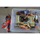 A box of action men with vehicles