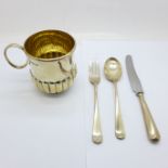 A Scottish silver Christening mug and a silver fork, spoon and knife set, 204g