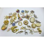 A collection of thirty-five brooches