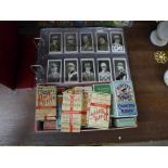 An album of cigarette cards and cigarette packets, including two sets of Ogdens, dogs, steeplechase,