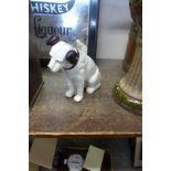 A reproduction cast iron figural dog