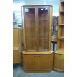 A Turnidge teak corner cabinet